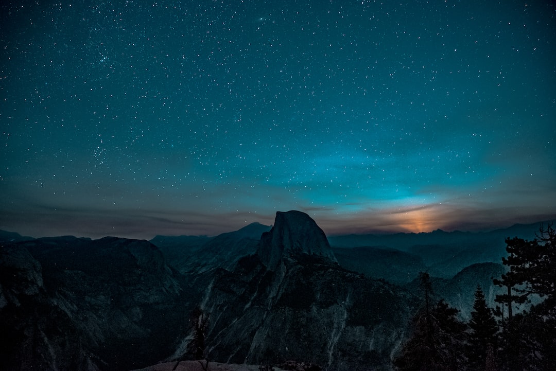 the breathtaking beauty of mountain trails: a winding path nestled amongst towering evergreens, dappled sunlight filtering through the dense canopy, and a serene river flowing alongside, reflecting the majestic peaks in its crystal-clear waters